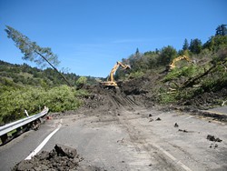 PHOTO BY FELIX OMAI. - Caltrans and its contractor Shea Construction, out of Redding, got busy cleaning up the slide and soon had a mud path open for emergency vehicles.