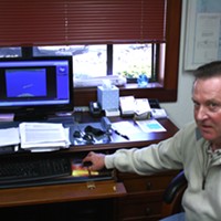 Captain John Powell spends more time than he'd like his desk. His computer is running an educational simulation he helped create, of a ship entering Humboldt Bay.