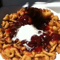 Carpe dough: strawberries and whipped cream on a funnel cake.