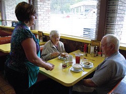 PHOTO BY HEIDI WALTERS - Charlene Hansen Primofiore serving regulars Eleanor and Richard Sweet, of Rio Dell, on a recent Friday at the cafe.