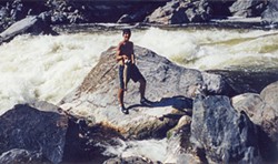 PHOTO COURTESY OF CRISPEN MCALLISTER - Crispen McAllister, 15, stands at Ishi Pishi Falls near Somes Bar. He says he plucked that fish out of the pool by his feet with his hands.