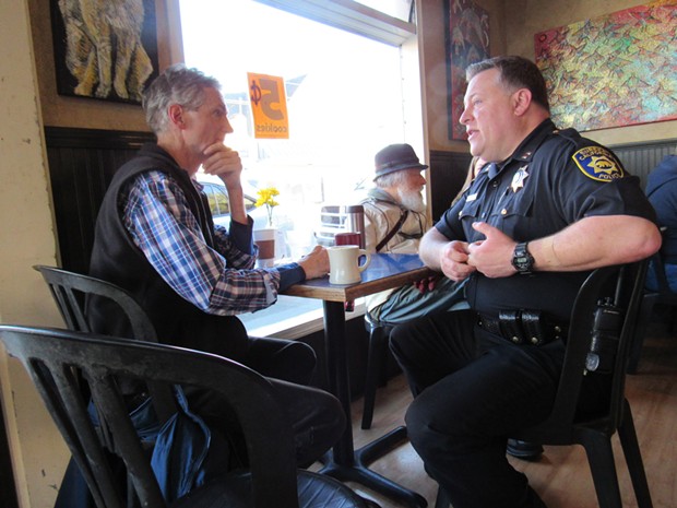 Eureka resident Jim Hight (left) listens as Capt. Steve Watson of the Eureka Police Department explains their policing strategy. - LINDA STANSBERRY