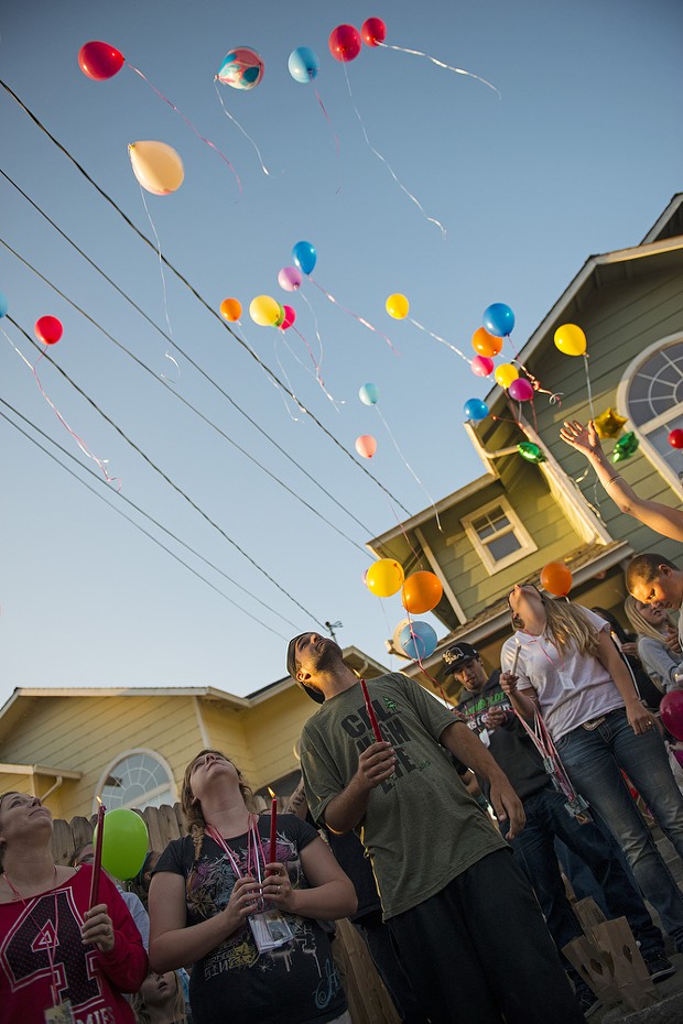 Friends and family release balloons during a vigil for Thomas "Tommy" McClain who was fatally shot by Eureka police early Wednesday morning. - MARK MCKENNA