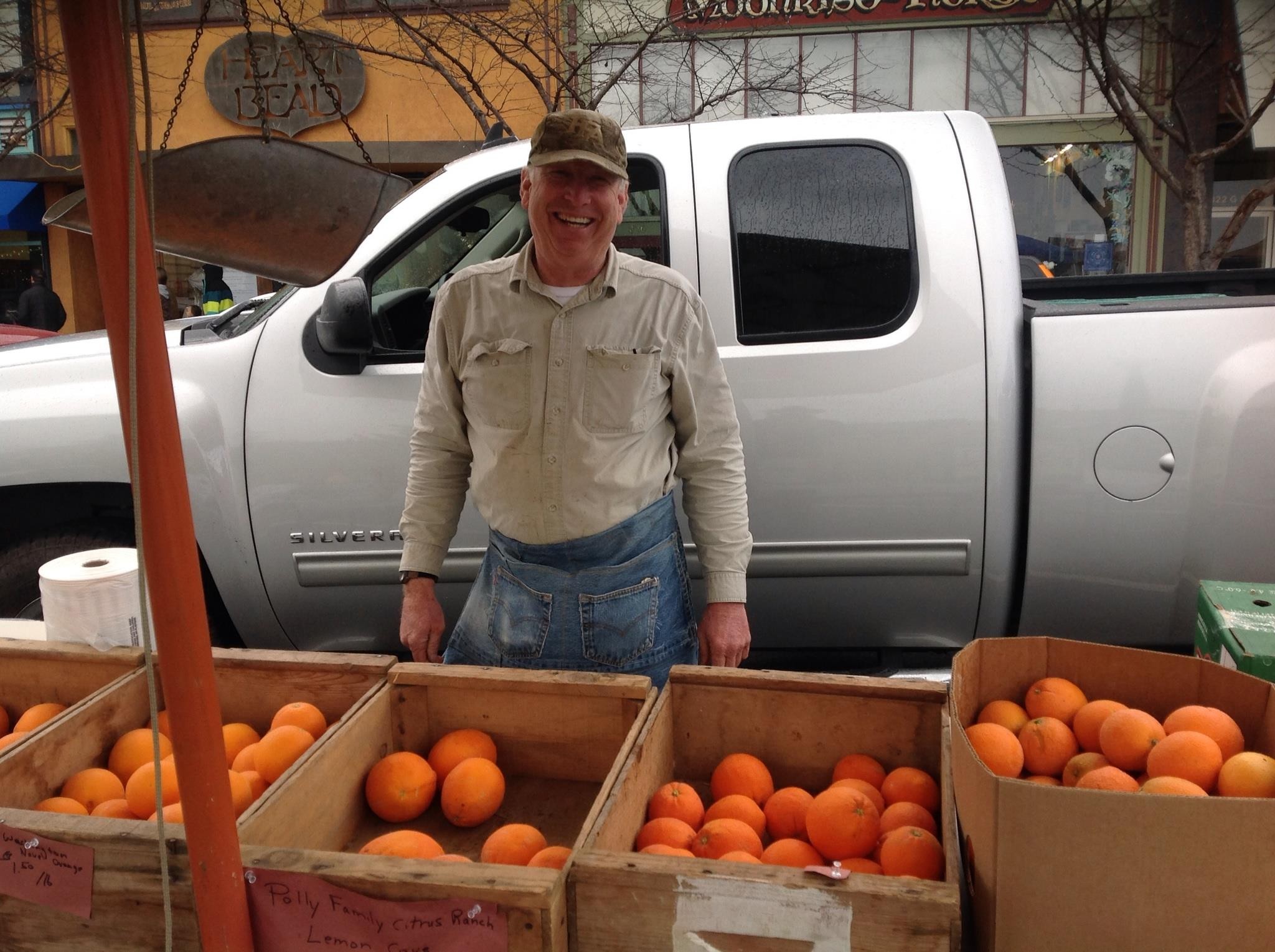 Jim Polly from Lemon Cove selling his family farm's citrus at the Arcata Winter Market. - PHOTO BY BOB DORAN