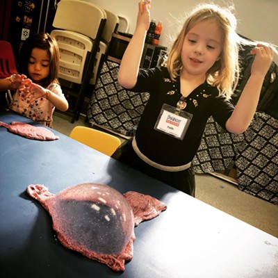 Children making slime at the Discovery Museum