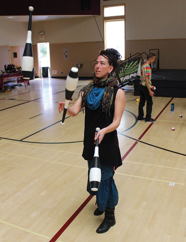 Kira Davis practices with juggling clubs at the 14th annual Humboldt Juggling Festival, which ran all weekend at the Arcata Community Center. - PHOTOS BY BOB DORAN.
