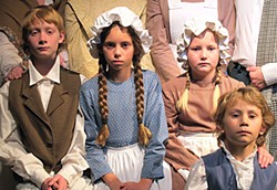 (L to R) Alex Sutter as Peter Cratchit, Gaia Denisi as Miranda Cratchit, Allison Boltzen as Gillian Cratchit, Dori Denisi as Tiny Tim, from the cast of NCRT's A Christmas Carol.