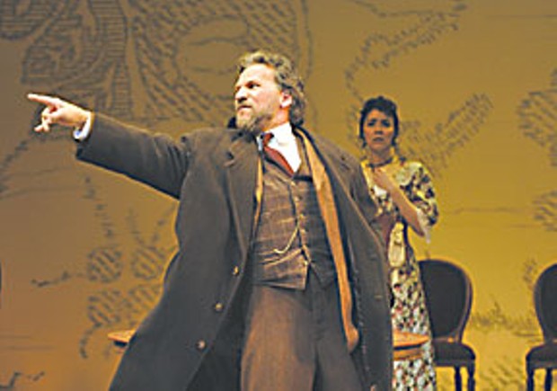 Lopakhin (Armando DurÁn) exults after buying the cherry orchard. Dunyasha (Nancy Rodriguez), looks on. Photo by David Cooper.