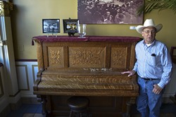 PHOTO BY GRANT SCOTT-GOFORTH - Oberon co-owner Roy Kohl won't let anyone play his upright grand piano in the Oberon Grill because of music licensing fees.