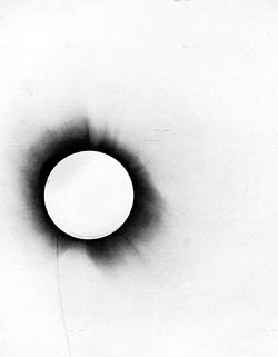ROYAL SOCIETY OF LONDON, PUBLIC DOMAINLAST WEEK, WE SAW HOW BRITISH ASTRONOMERS SAW AN OPPORTUNITY TO TEST THE PREDICTIONS OF EINSTEIN'S 1915 THEORY OF GENERAL RELATIVITY DURING A TOTAL SOLAR ECLIPSE. - One of only two usable negatives from Eddington's Principe site. Squint at the dots between the horizontal reference lines to see how faint the star images are due to clouds.
