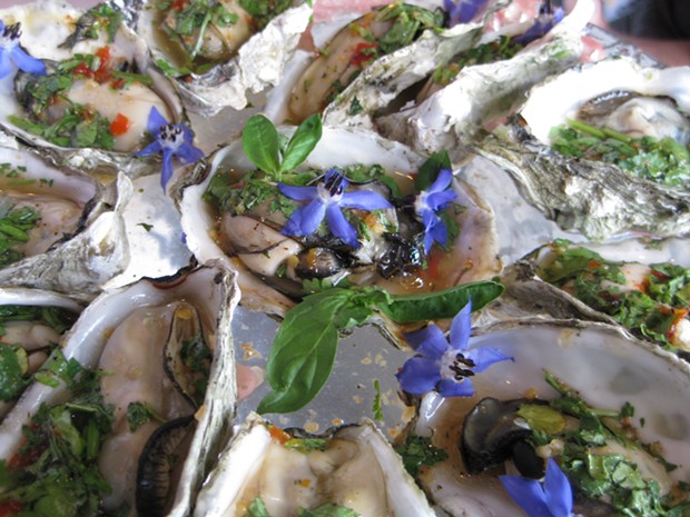 Oysters with sweet chili, fish sauce and cilantro. - JENNIFER FUMIKO CAHILL