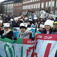 Parliament Square, Copenhagen Denmark, 12/12/2009  1 PM Japanese Coop members join the March. Photo by David Simpson.