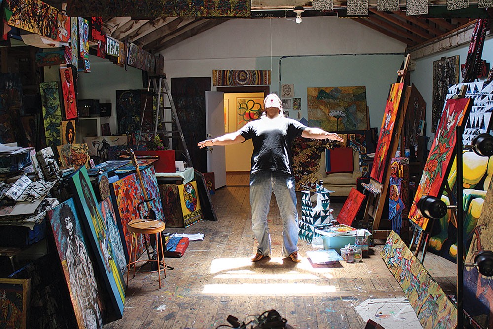 Prolific painter Augustus Clark soaks up the sun in his workspace in Eureka's C Street Studios on Sunday, June 1, day two of the countywide North Coast Open Studios, which continues this weekend. - PHOTO BY BOB DORAN