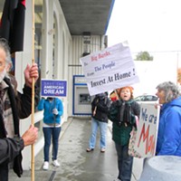 Protesters chant outside Chase in Eureka on Saturday.