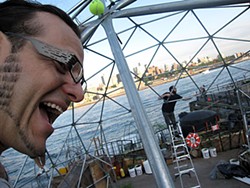 Self-portrait of HSU instructor Lonny Grafman, helping construct a geodesic dome on a barge called the Waterpod.