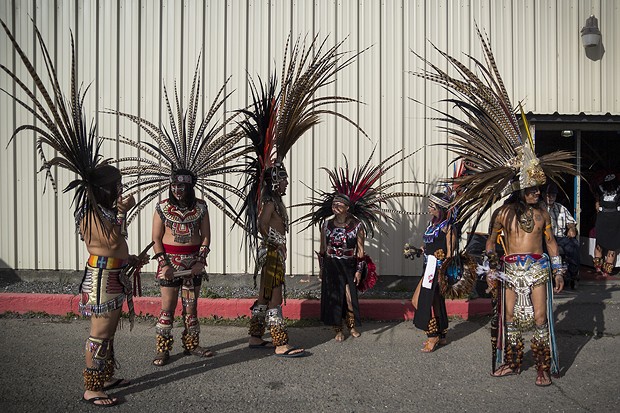 Tezkatlipoka Aztec Dance & Drum group awaits for its performance outside of Franceshi Hall. - MANUEL J. ORBEGOZO