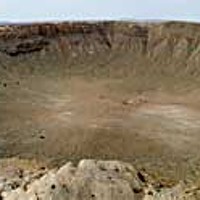 The Barringer Meteor Crater, nearly a mile across and a quarter mile deep, 40 miles east of Flagstaff, Arizona. Phot panorama by Barry Evans.