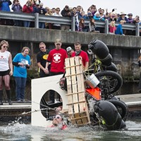 The Moonshine Banditos capsize shortly after entering Humboldt Bay during the second day of the 2015 Kinetic Grand Championship.