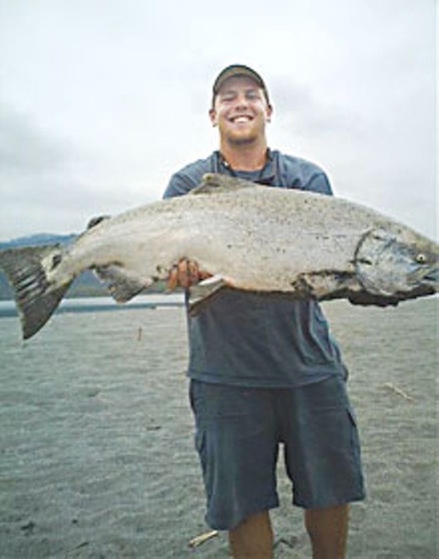 Tyler Duncan shows off his giant catch. The salmon weighed an estimated 40 pounds, and Duncan gave the prize catch to Native Americans fishing nearby that day. Photo courtesy Rich Denaio.