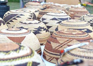 Traditional Hupa woven hats. - PHOTO BY CUTCHA RISLING BALDY
