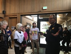 Arcata Interim Police Chief Richard Ehle offers an update on the investigation into the stabbing death of David Josiah Lawson after protesters disrupted a council meeting in August. - CARMEN PENA-GUTIERREZ