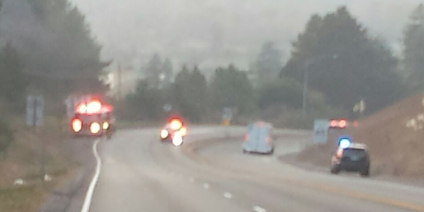 Fire engines and law enforcement along Hwy 299 at a fire that is now under control. - PHOTO COURTESY OF MARK NELSON