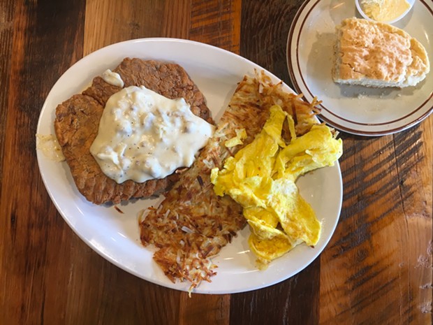 Chicken fried steak with hash browns, scrambled eggs and a biscuit. - PHOTO BY JENNIFER FUMIKO CAHILL