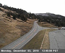 Emergency vehicles prepare the landing zone for the helicopter at Berry Summit. - CALTRANS TRAFFIC CAM