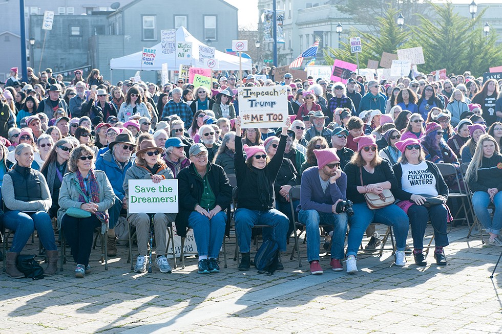 Demonstrators gather at the foot of C Street in Eureka to listen to speakers before the 2018 Women's March. - PHOTO BY MARK MCKENNA