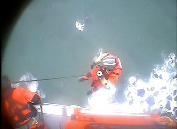 A rescue swimmer is lowered down 250 feet to a stranded hiker in this file photo. - U.S. COAST GUARD
