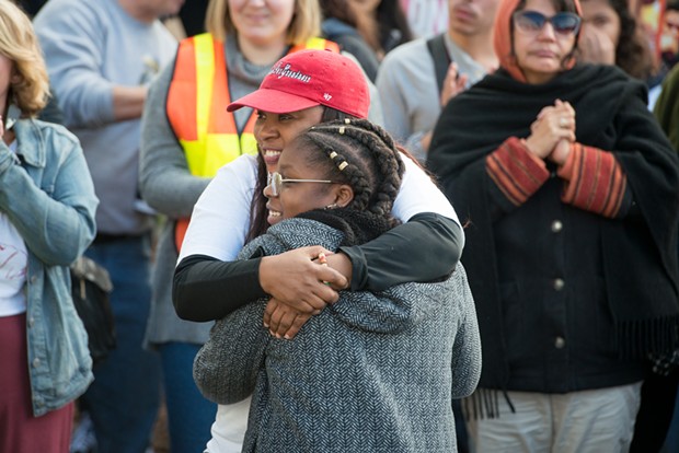 Charmaine Lawson hugs Sadie Shelmire, 11, after Shelmire spoke of the racism she has experienced in Humboldt County. - MARK MCKENNA