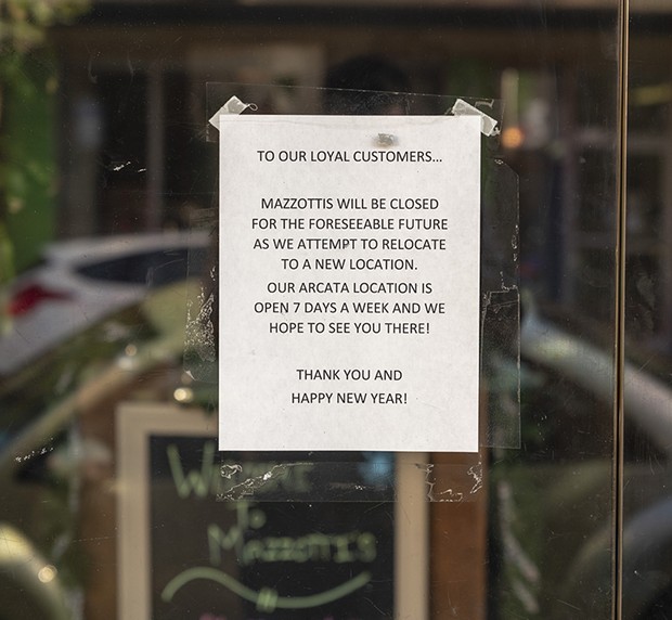 The sign on the glass door of Mazzotti's in Eureka. - PHOTO BY ZACH LATHOURIS