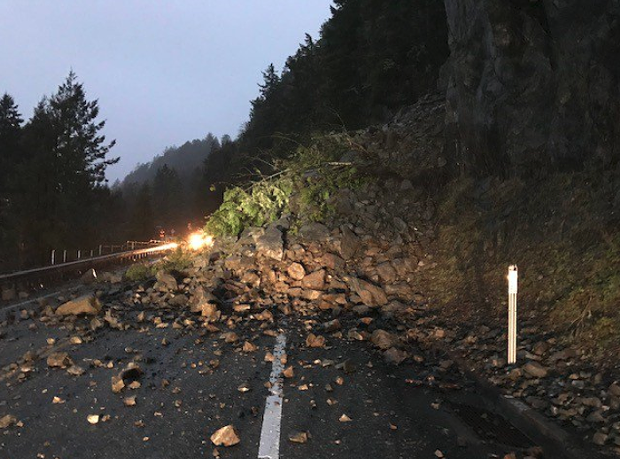 A slide left boulders and trees covering U.S. Highway 101 last night. - CALTRANS