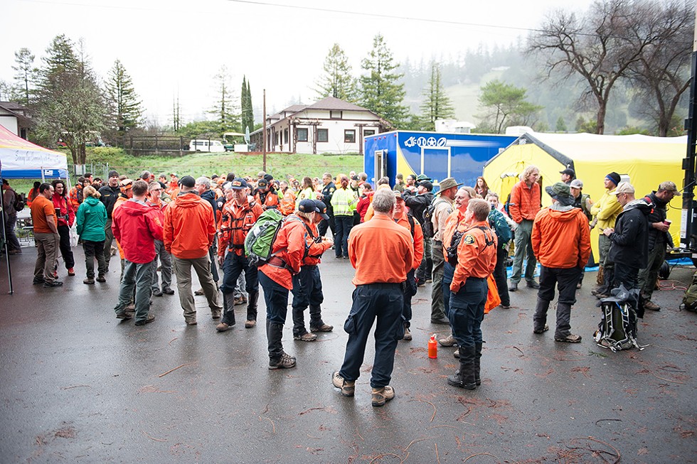 Search teams from across Northern California gathered for the morning briefing on March 3. - PHOTO BY MARK MCKENNA