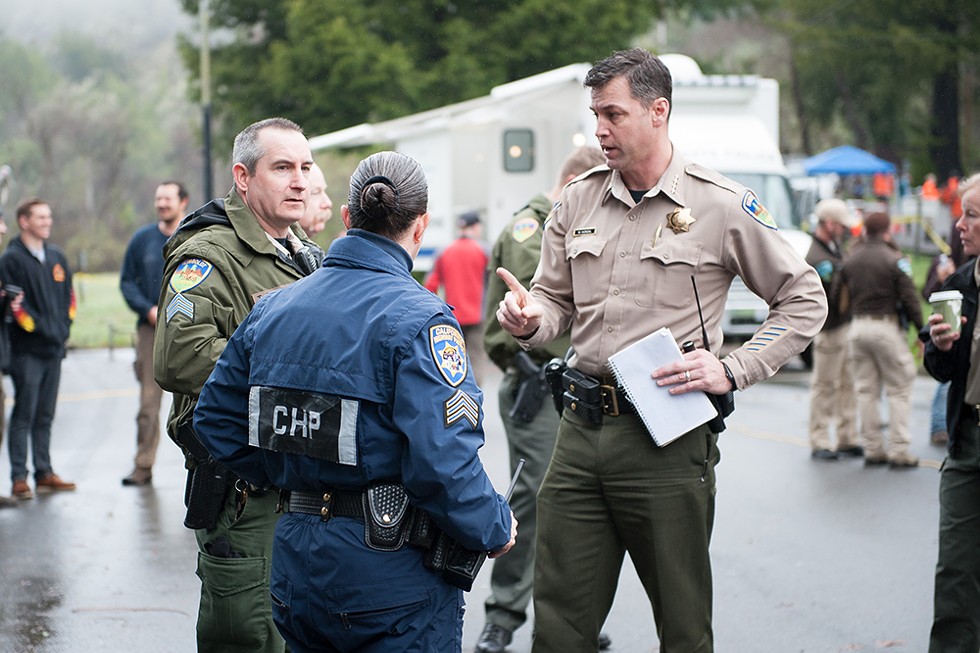 Humboldt County Sheriff William Honsal speaks with representatives from multiple agencies before the March 3 morning briefing. - PHOTO BY MARK MCKENNA