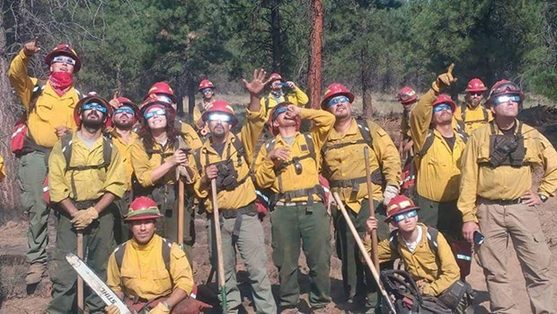 Benito Nuñez-Rodriguez (lower left) with his firefighting unit. - SUBMITTED