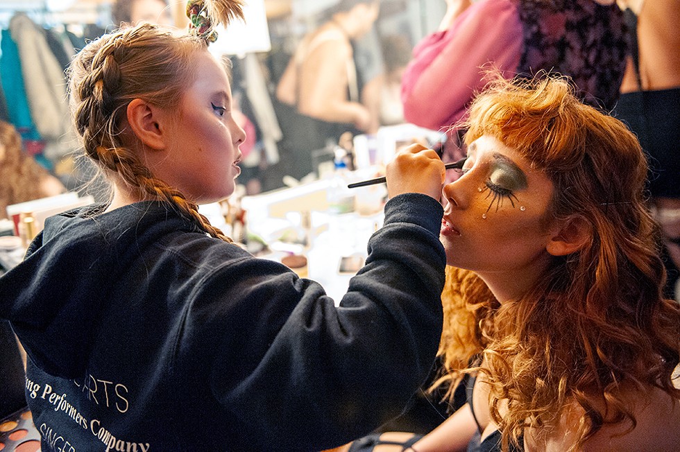 Ten-year-old Lily Herlihy helps Maggie Hockaday with her makeup. - PHOTO BY MARK MCKENNA