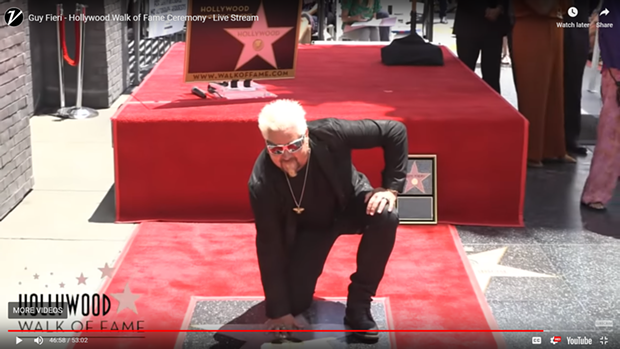 A screenshot of Guy Fieri and his star. - WALK OF FAME VIDEO