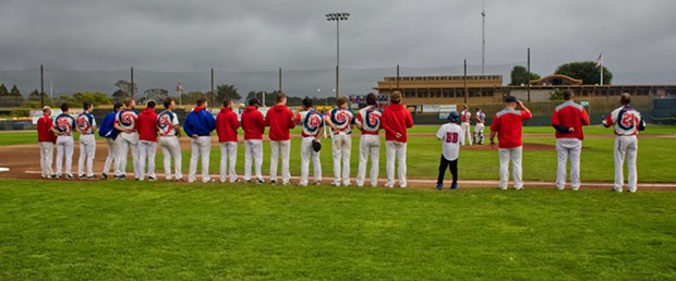 The Crabs stand for the National Anthem in front of a perfect Humboldt summer evening. - MATT FILAR