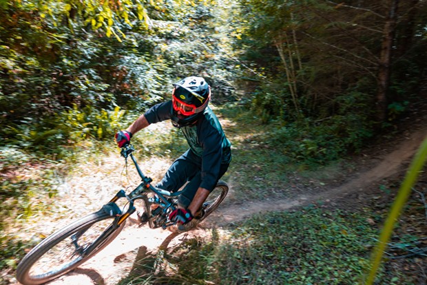 A rider takes on a drop and prepares for another on the trail through Green Diamond property a day ahead of the Mad River Enduro race. - CONNOR RAY PHOTOGRAPHY