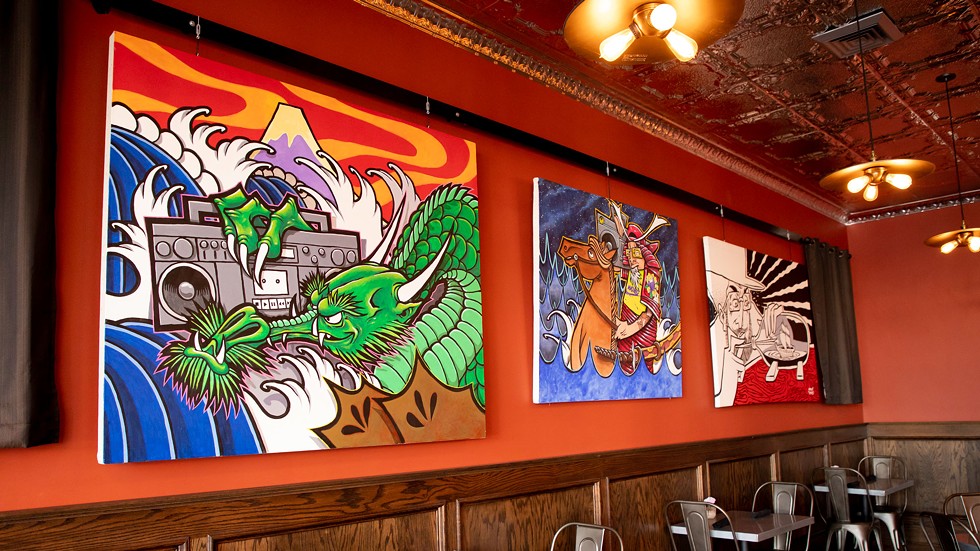 Paintings of Wong’s hanging at the Diver Bar & Grill in Eureka. - AMY KUMLER