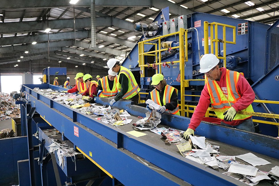 Community members and Eureka city officials working on the paper sorting line at Recology on Nov. 10.