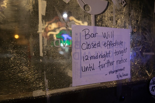 A sign on the door at Parkway Lounge in Oakland, California. - ANNE WERNIKOFF FOR CALMATTERS