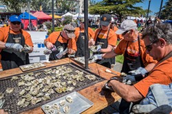 A Pacific Seafood oyster-shucking crew. - PHOTO BY MARK LARSON