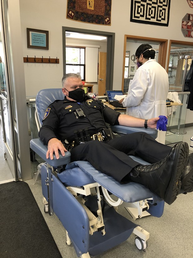 EPD Capt. Brian Stephens donates during the blood drive. - EPD