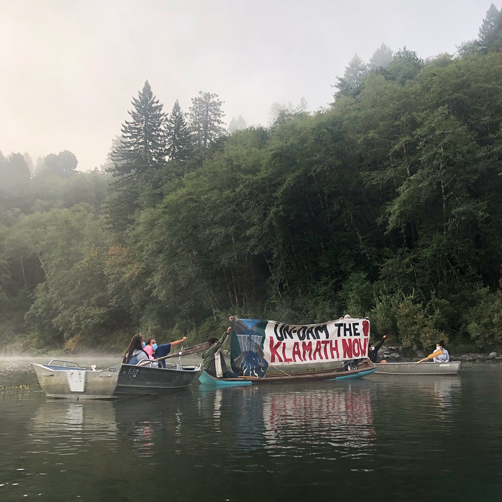 A floating blockade stretches across the Klamath River waiting to stop boats carrying Yurok and Karuk tribal officials and Berkshire Hathaway executives upriver on Aug. 28, 2020.