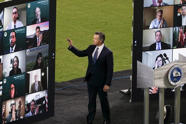 Gov. Newsom waves to virtual guests during the State of the State address at Dodger Stadium on March 9, 2021. - PHOTO BY SHAE HAMMOND FOR CALMATTERS