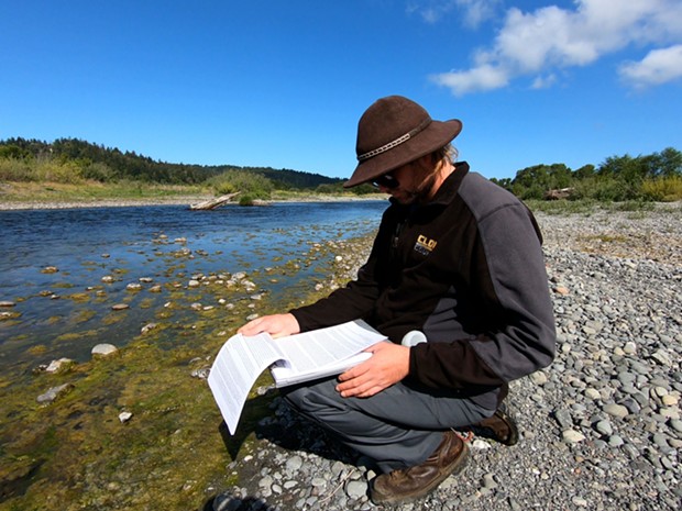 The Blue Lake Rancheria Tribe’s Environmental Scientist Jacob Pounds samples the algae mats for analysis. - BLUE LAKE RANCHERIA