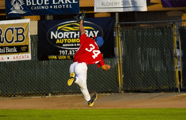 Crabs outfielder Tyler Ganus (#34) makes a leaping play to catch a long fly ball in right field on June 19, 2021 against the Seattle Studs at Arcata Ballpark. - THOMAS LAL