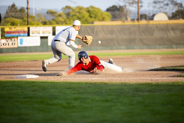 Crabs second baseman Ethan Fischel slides into third past the throw for a triple on July 23 while facing TKB Baseball at Arcata Ballpark. - THOMAS LAL